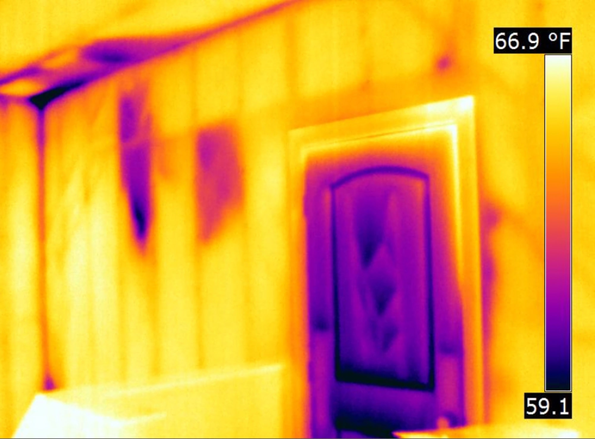 Missing insulation highlighted in purple on the thermal image