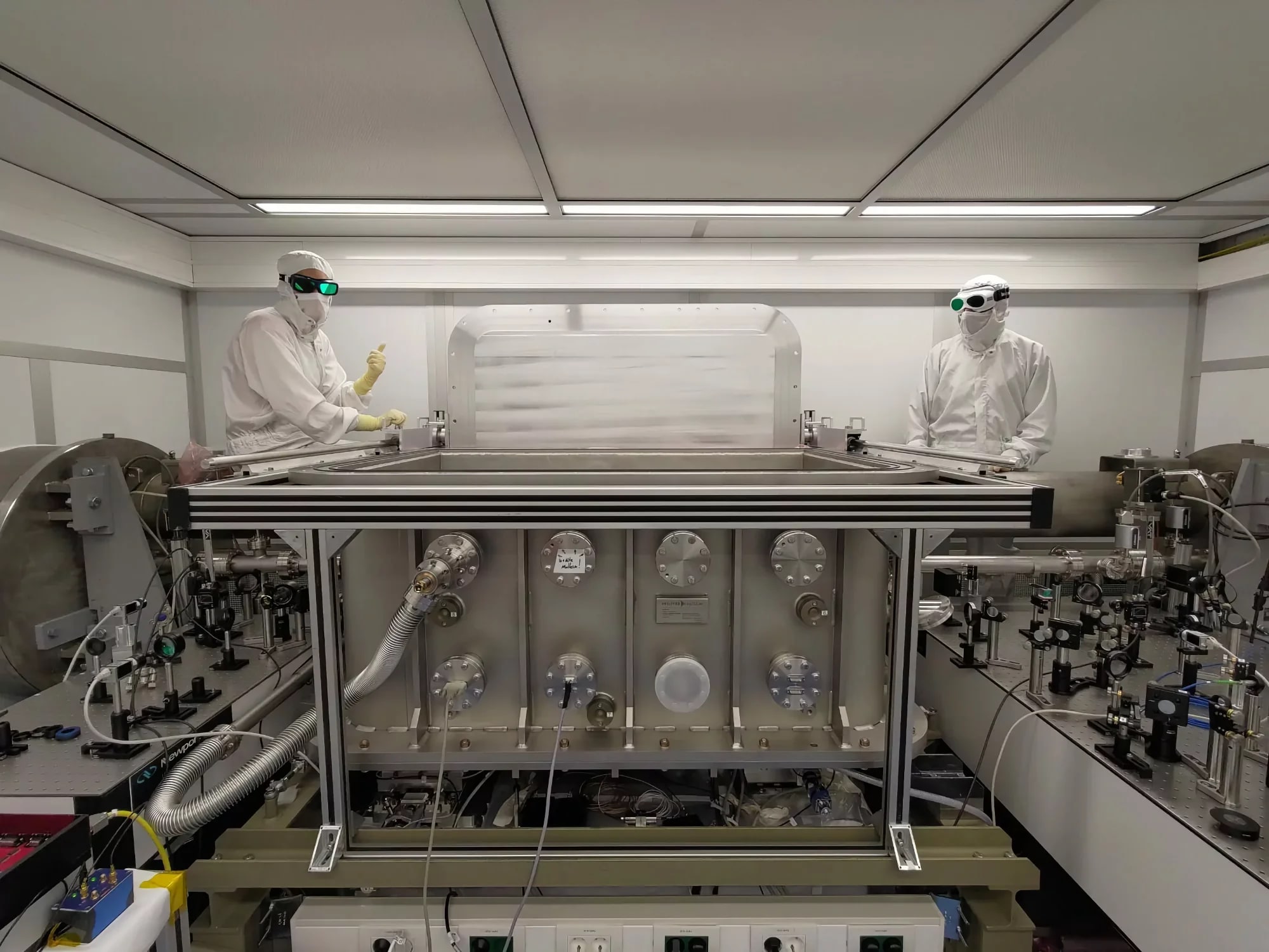 ALPS team members working in a cleanroom at DESY